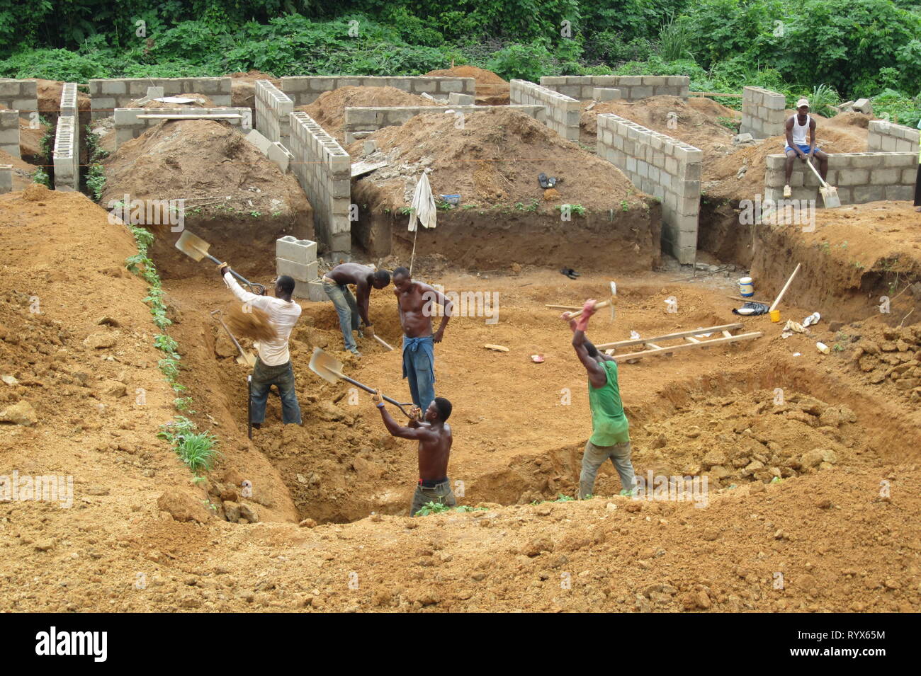 Nigerian workers making a manual excavation in the construction site of