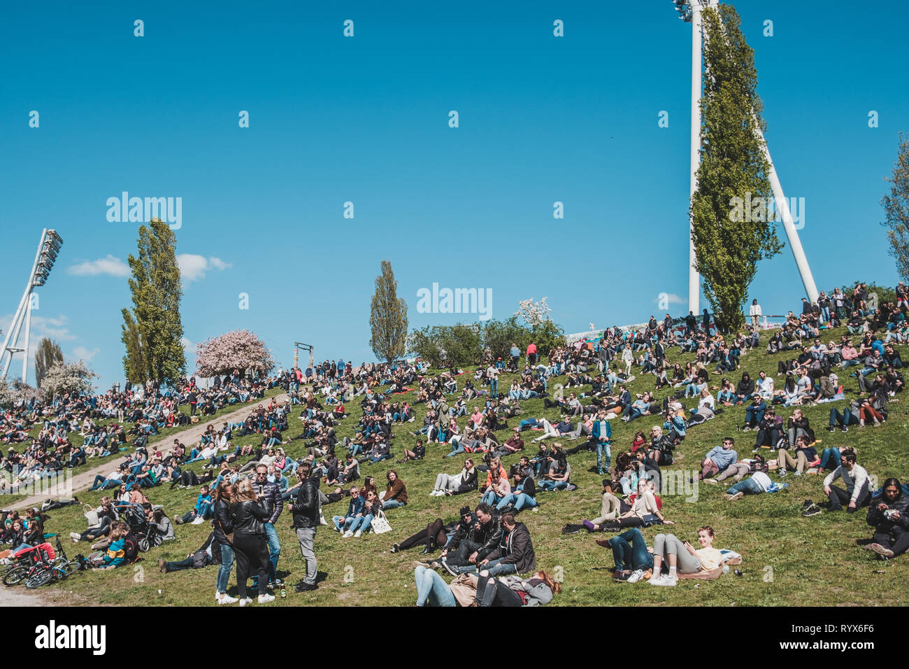 Berlin, Germany- april 2017: Young people in crowded park (Mauerpark) in Berlin, Germany on a sunny summer day Stock Photo