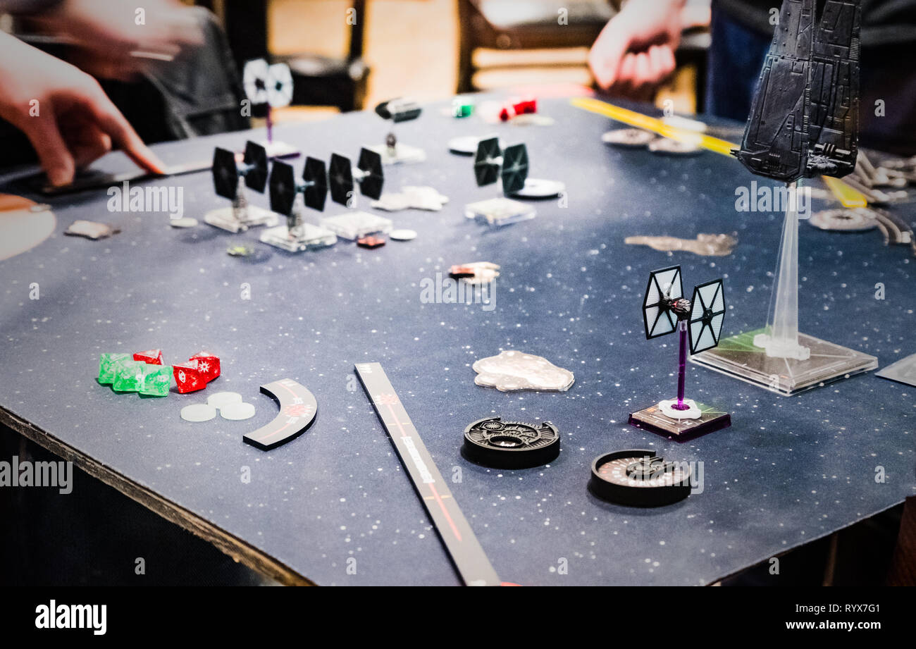 People playing board games in the Thirsty Meeples Gaming cafe in Oxford city centre Stock Photo
