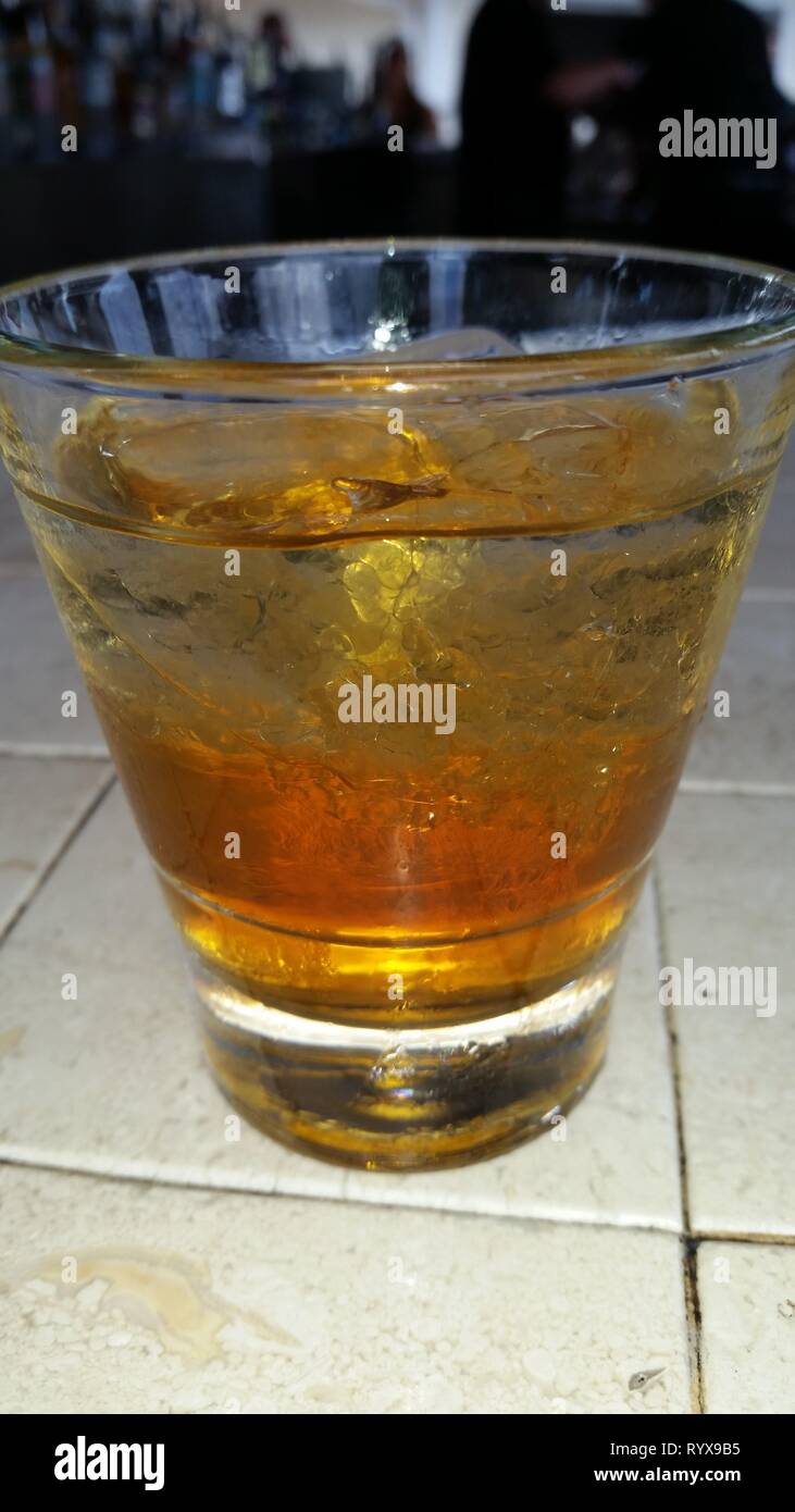 Glass of whiskey and water with ice Stock Photo Alamy