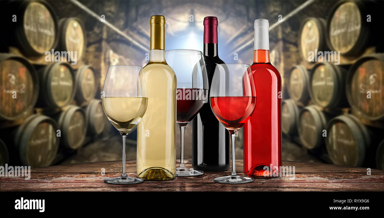 Collection of equisite red white and rose wine bottle glasseson wooden