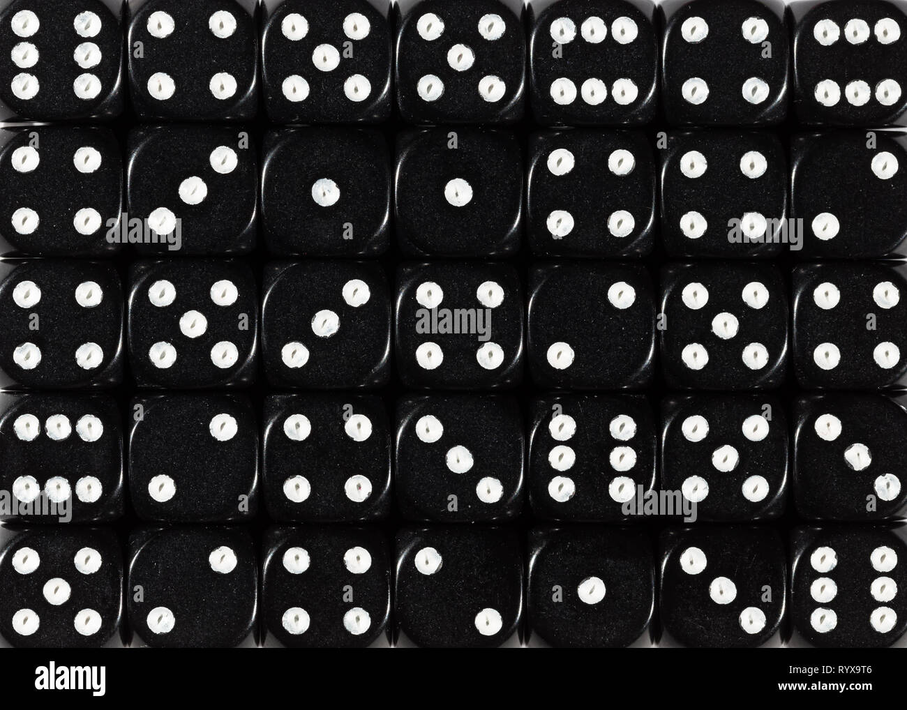 Background pattern of black dices, random ordered Stock Photo