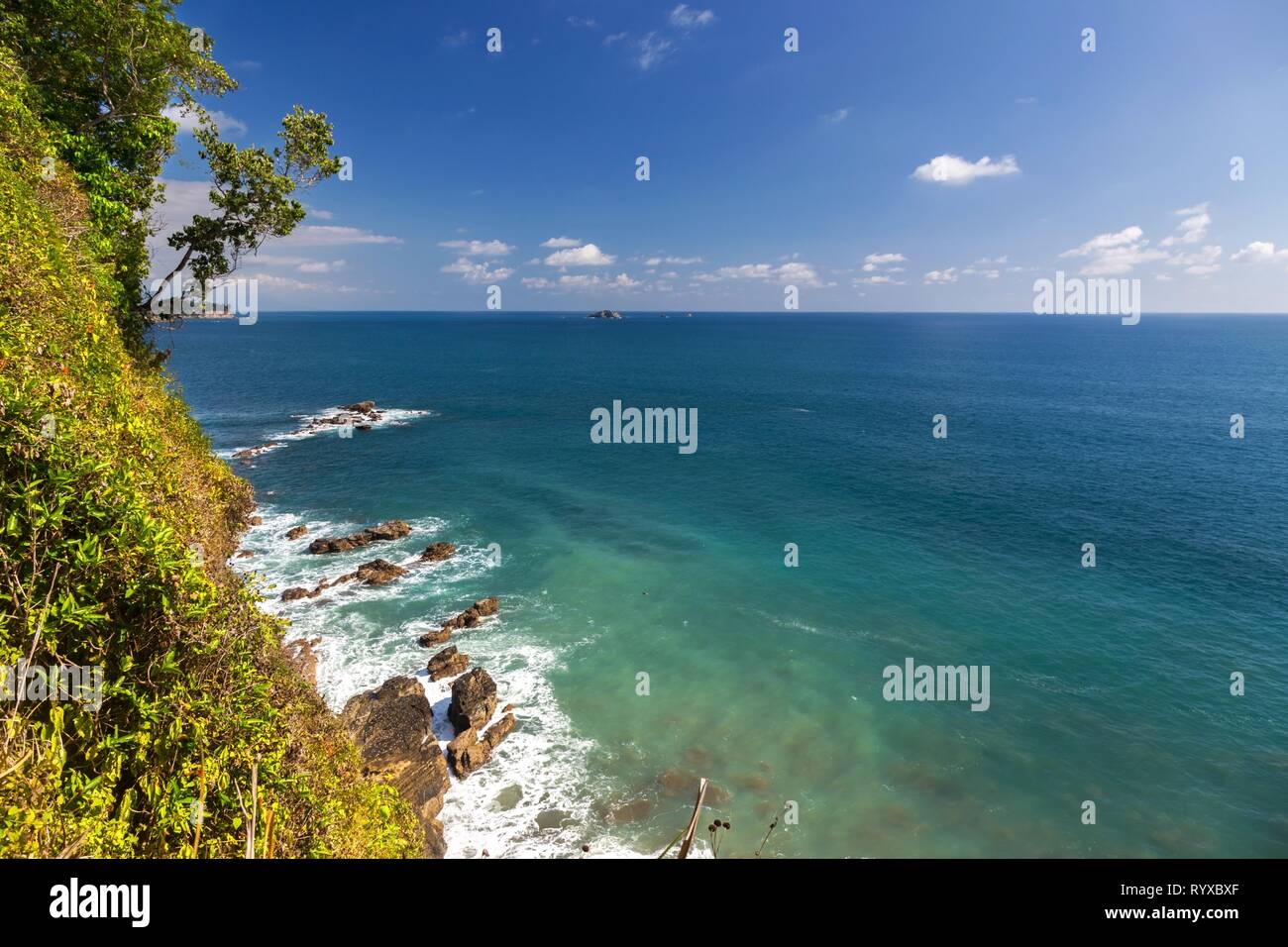 Scenic Landscape view of Pacific Ocean Coastline from Sendero Punta Catedral Hiking Trail in Manuel Antonio National Park Costa Rica Stock Photo