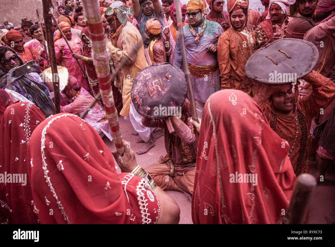 Male ,participants,Lathimar Holi,escaping,Lathis charges,of Females,,at Barsana,event ,place,as a part,of Centuries ,rituals,upholding,honour,of ,wome Stock Photo