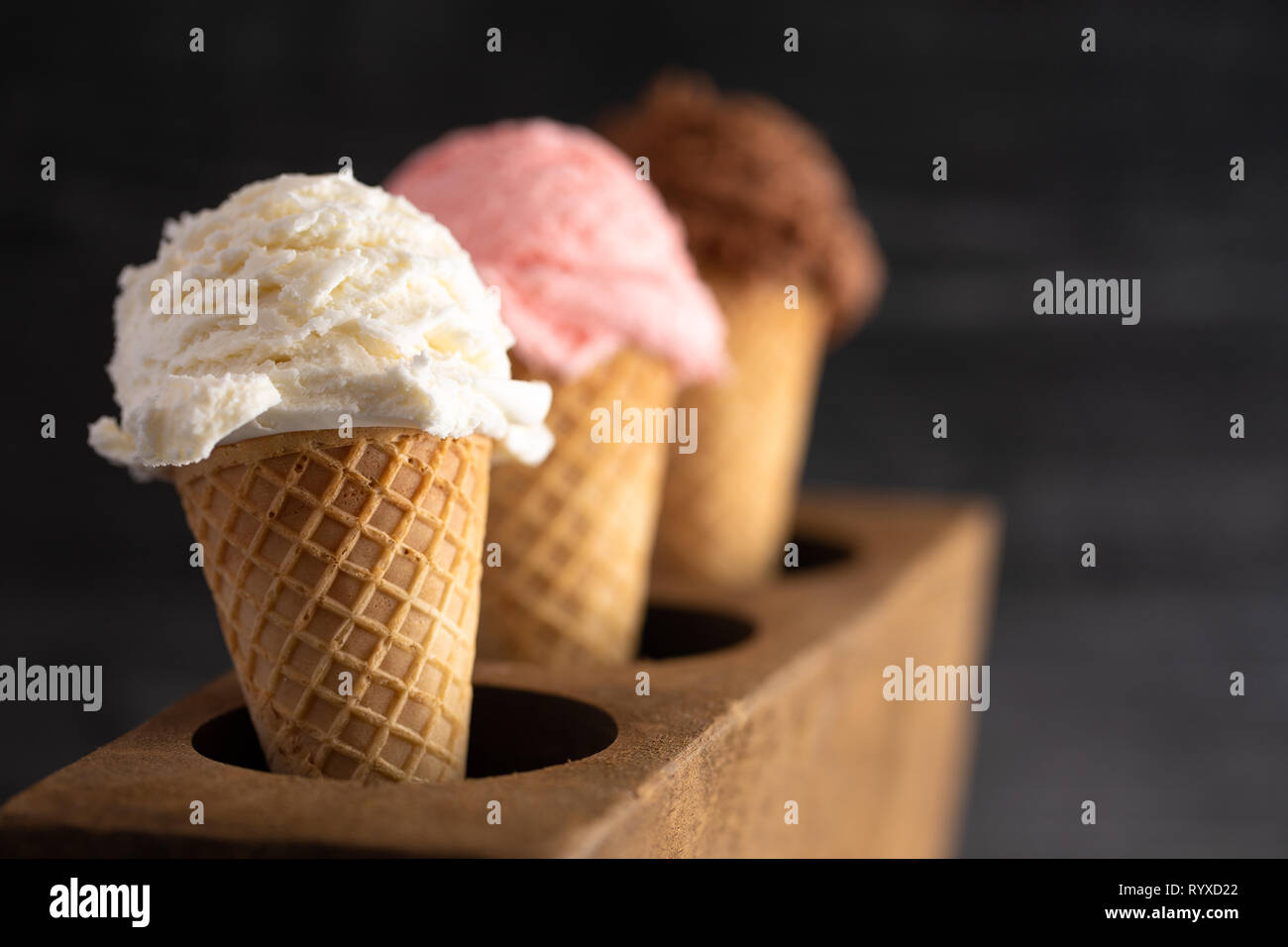 Line of Three Classic Flavors of Ice Cream in a Wooden Sugar Mold Stock Photo Alamy