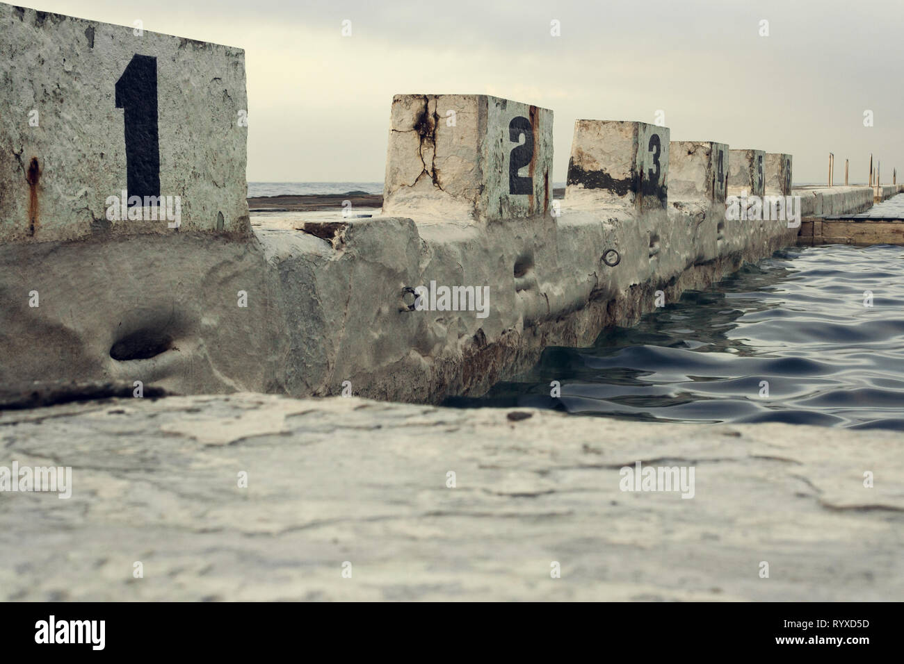 Concrete diving blocks at the Newcastle Ocean Baths Stock Photo - Alamy