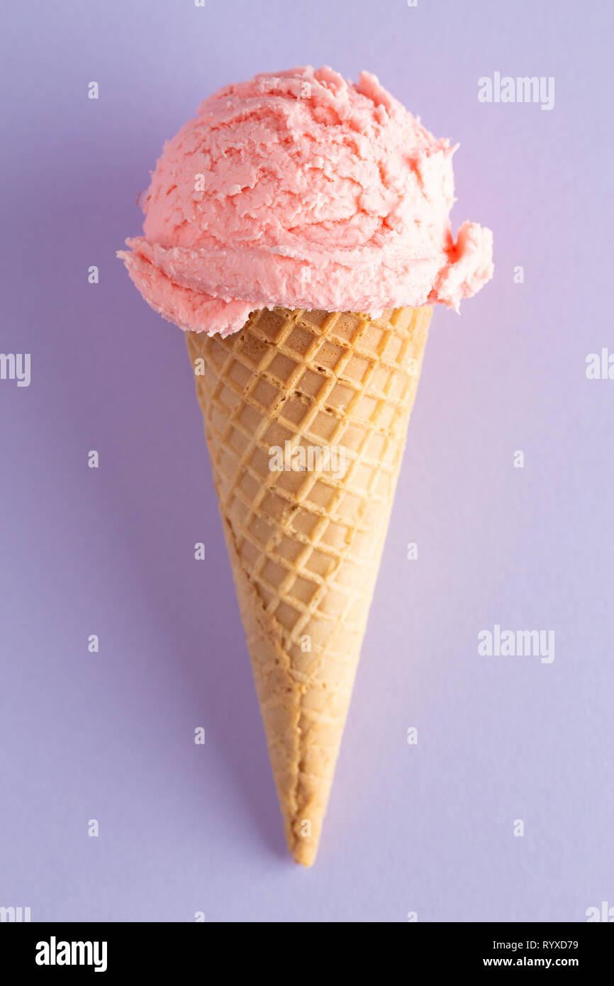 A Scoop of Strawberry Ice Cream in a Waffle Cone Stock Photo - Alamy