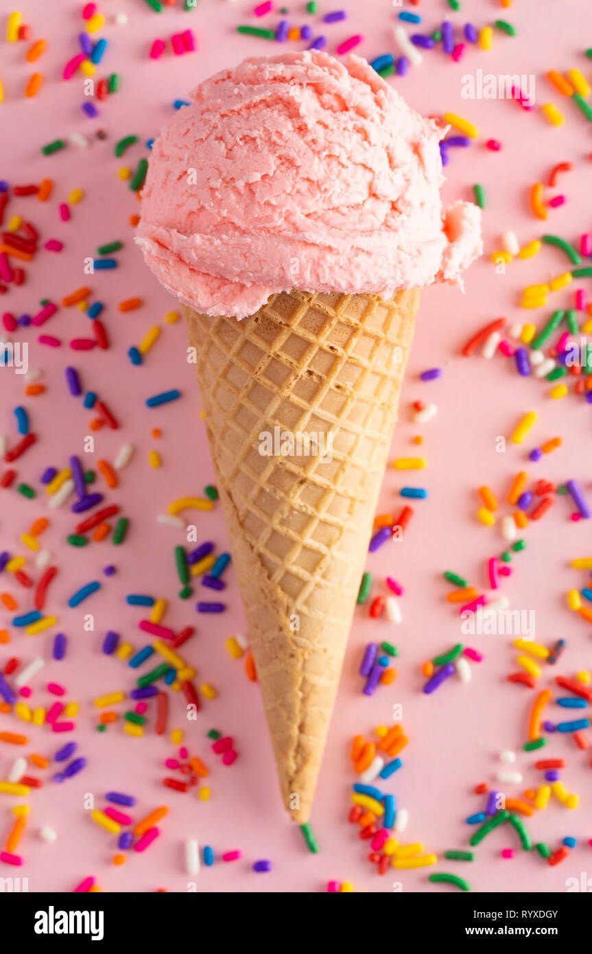 A Scoop of Strawberry Ice Cream in a Waffle Cone Stock Photo - Alamy