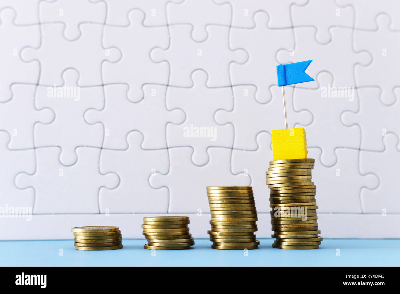 concept image of Saving money or investing. putting stack of coins at ...