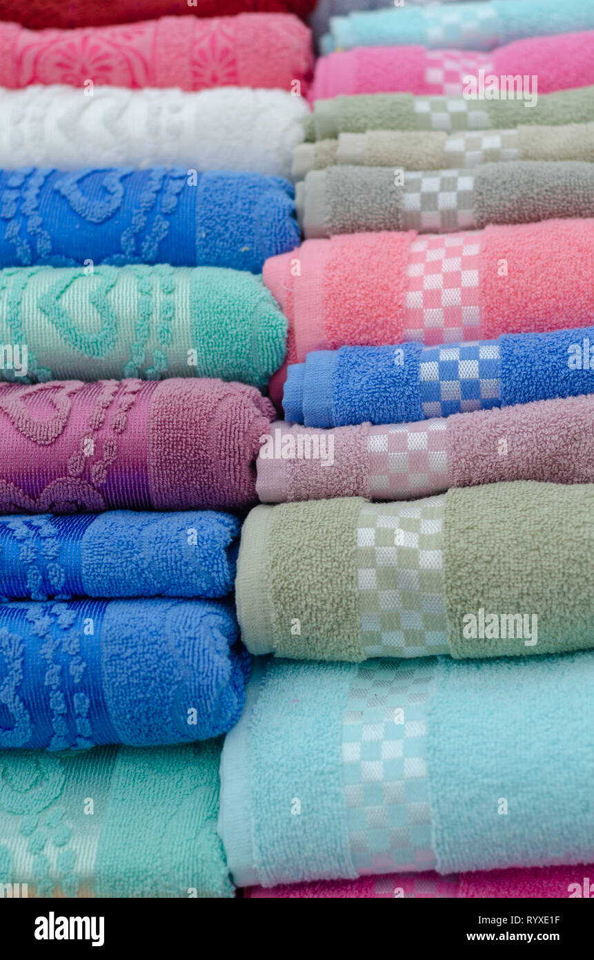 Pile of colored towels for sale at the market Stock Photo Alamy