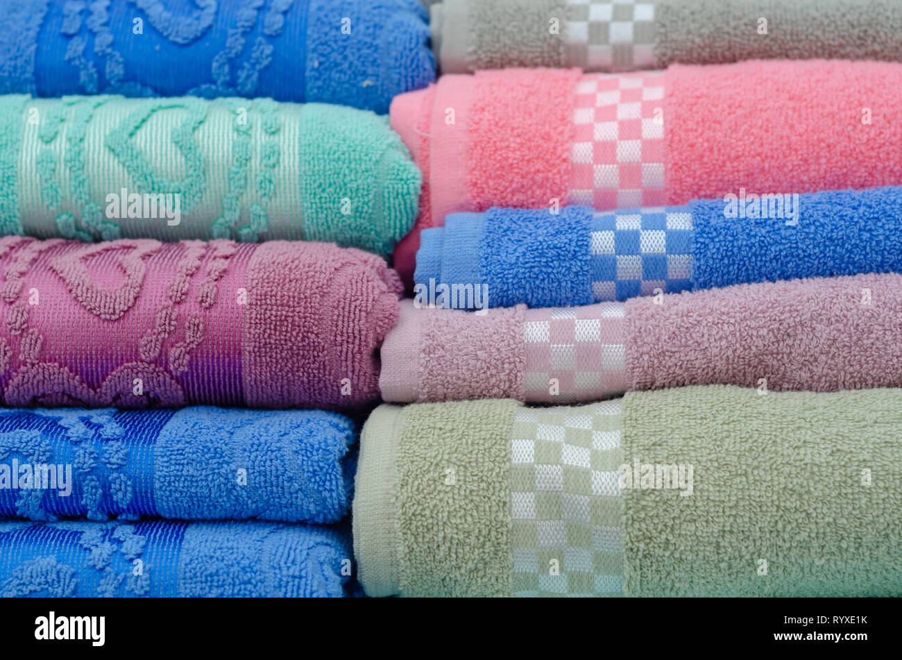 Pile of colored towels for sale at the market Stock Photo Alamy
