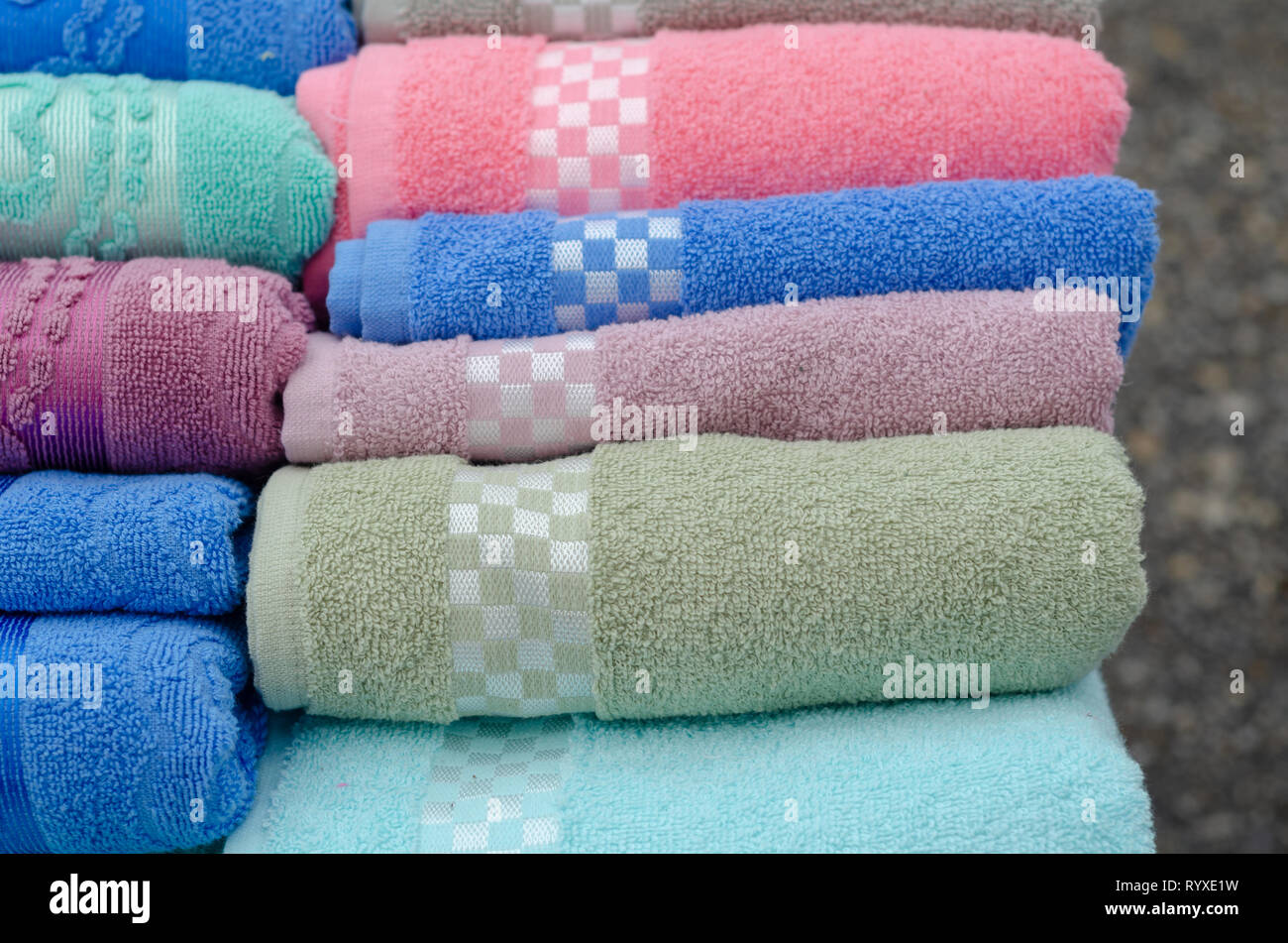 Pile of colored towels for sale at the market Stock Photo Alamy