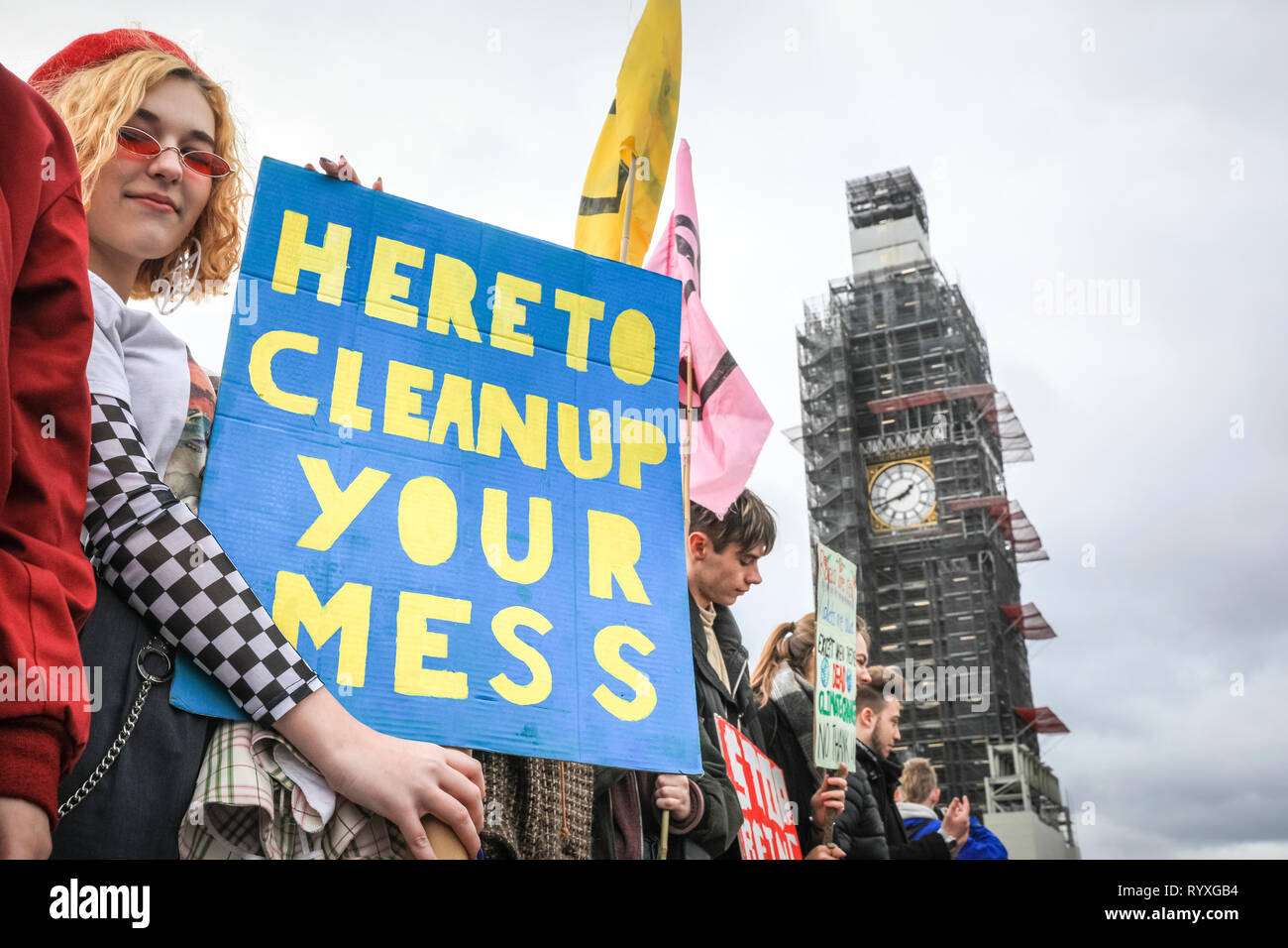 Westminster, London, UK, 15th Mar 2019. Young climate protesters make their voices heard on Westminster Bridge in the heart of London. Students, school children and young people in cities around the world rally in 'Youth Strike 4 Climate' action to protest against lack of government action against climate change. Credit: Imageplotter/Alamy Live News Stock Photo