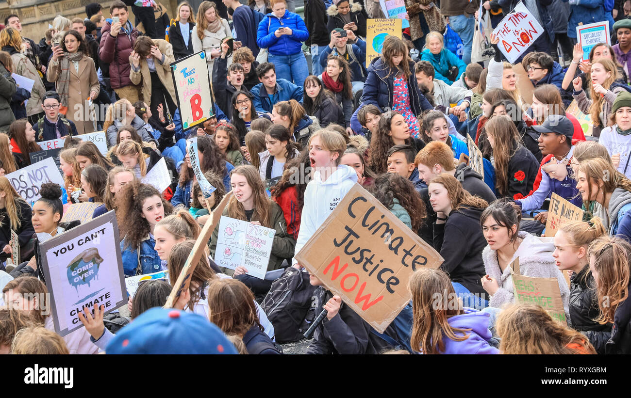 Westminster, London, UK, 15th Mar 2019. Young climate protesters make their voices heard on Westminster Bridge in the heart of London. Students, school children and young people in cities around the world rally in 'Youth Strike 4 Climate' action to protest against lack of government action against climate change. Credit: Imageplotter/Alamy Live News Stock Photo