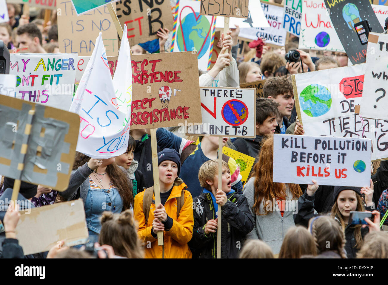 Bristol, UK. 15th March, 2019. Bristol college students and school children carrying climate change placards and signs are pictured as they protest outside Bristol City Hall. The pupils who also went on strike last month walked out of school again today as part of a countrywide coordinated strike action to force action on climate change policy. Organisers of the UK Youth Strike 4 Climate movement say that pupils from more than 100 towns and cities across the UK will skip classes today and will instead protest against climate change. Credit: Lynchpics/Alamy Live News Stock Photo
