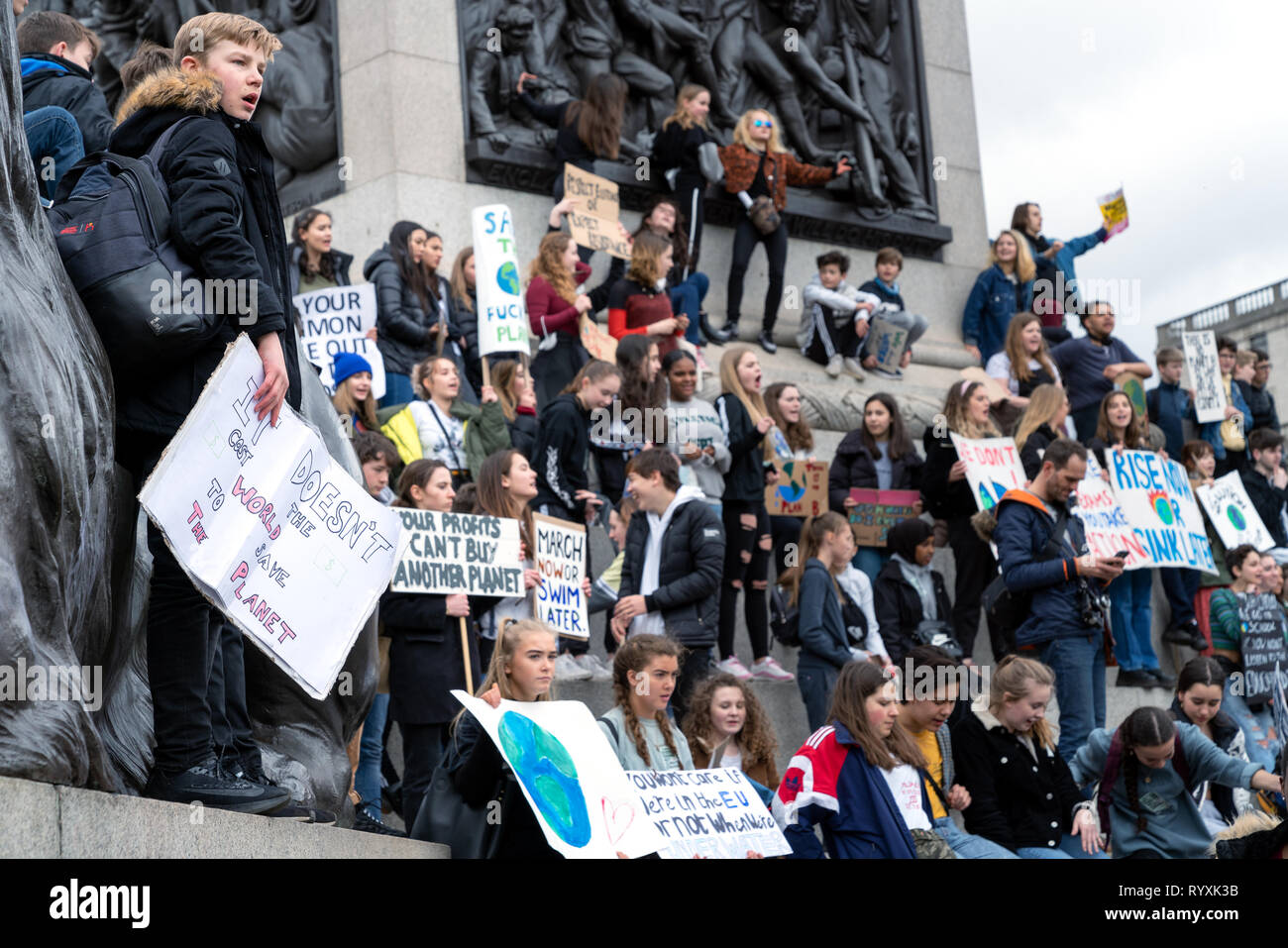 London, UK. 15th Mar, 2019. Group of youths with banners and flags strike for climate change outside Trafalgar Square. Credit: AndKa/Alamy Live News Stock Photo