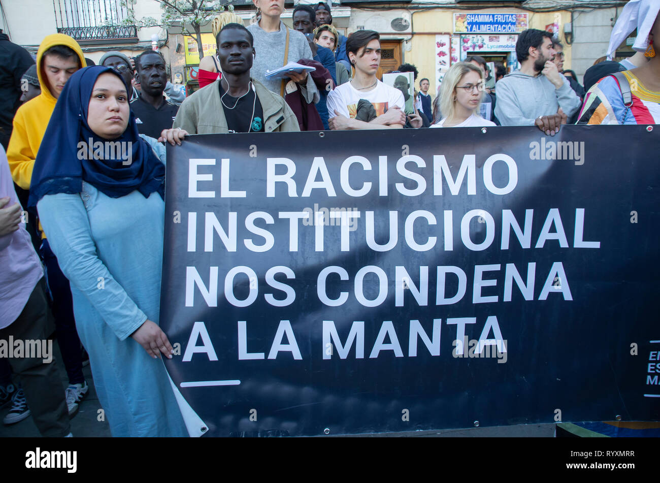 Madrid, Spain. 15th Mar 2019. A protest against institutional racism took place at Nelson Mandela square in Madrid one year after the death of Mame Mbaye, a Senegalese street vendor who died while being chased be the police for selling on the streets. According to the demonstratord, the young man did not have any legal papers despite having spent more than 10 years in Spain and authorities did not help his family after his death.   The protesters asked for justice and reported that they are constantly ignored and discriminated by Spanish authorities. Credit: Lora Grigorova/Alamy Live News Stock Photo