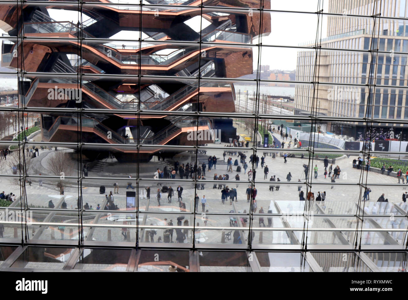 March 15, 2019 - New York City, New York, US - Hudson Yards, the largest private real estate development in American history opened to the public March 15, 2019 on the west-side of midtown Manhattan. The  $25 billion community rising above a working rail yard,  became an instant hit with its 4,000 residential apartments, 100 shops, office space, apartments, a public school and arts space â€“- featuring ''The Vessel'', a climbable sculpture made up of nearly 155 flights of stairs arranged into a honeycomb shape in the plaza. (Credit Image: © G. Ronald Lopez/ZUMA Wire) Stock Photo