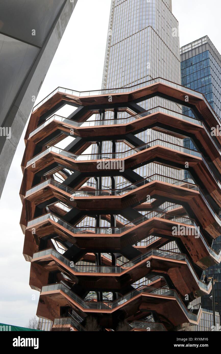 New York, NY, USA. 15th Mar 2019. Hudson Yards, the largest private real estate development in American history opened to the public March 15, 2019 on the west-side of midtown Manhattan. The $25 billion community rising above a working rail yard, became an instant hit with its 4,000 residential apartments, 100 shops, office space, a public school and arts space -- featuring 'The Vessel', a climbable sculpture made up of nearly 155 flights of stairs arranged into a honeycomb shape in the plaza. Credit: 2019 G. Ronald Lopez/DigiPixsAgain.us/Alamy Live News Stock Photo