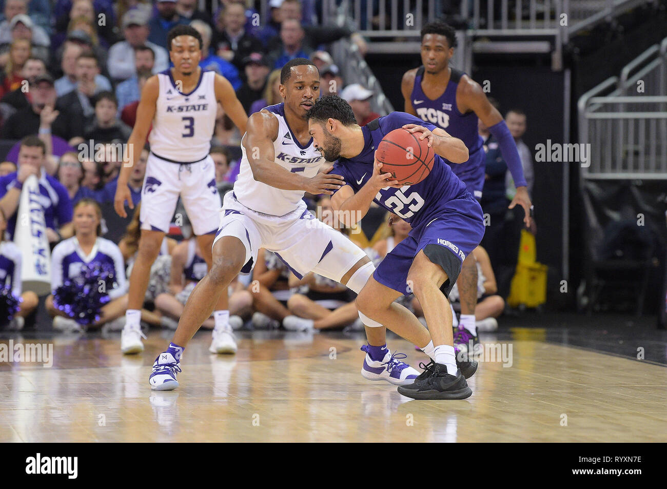 March 14, 2019: Kansas State Wildcats guard Barry Brown Jr. (5) applies pressure as TCU Horned Frogs guard Alex Robinson (25) handles the ball during the 2019 Phillips 66 Big 12 Men's Basketball Championship Semifinal game between the Kansas State Wildcats and the TCU Horned Frogs at the Sprint Center in Kansas City, Missouri. Kendall Shaw/CSM Stock Photo