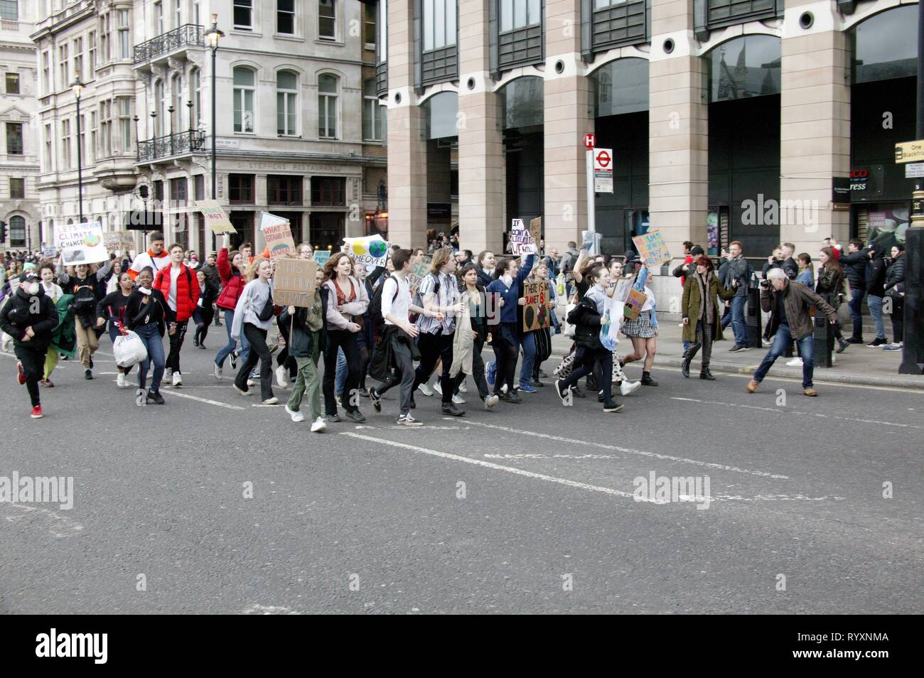 London, UK. 15th Mar 2019. 2nd UK-wide Youth Strike for Climate Brings Parliament Square and Westminster Bridge to a standstill after protesters block traffic into two main routes into the area Credit: Knelstrom Ltd/Alamy Live News Stock Photo