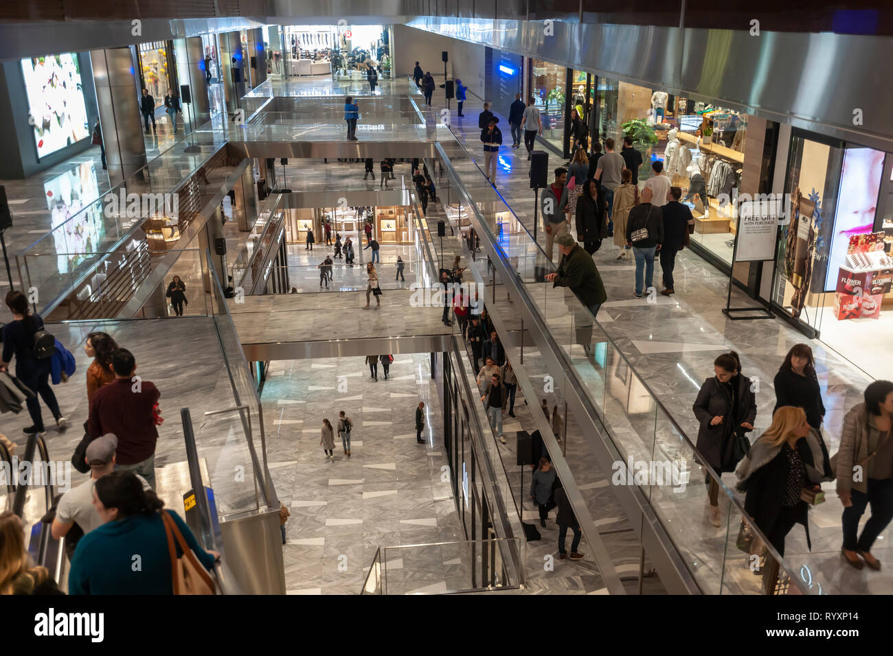 New York, USA. 15th Mar, 2019. Visitors crowd the Hudson Yards mall on the West Side of Manhattan on its grand opening day, Friday, March 15, 2019. Retailers, including the Neiman Marcus department store, opened their shops in the development which was built on a platform over the West Side railroad yards. Office, residential, public space and retail space comprise the first phase in what is arguably the most expensive construction project ever built in the U.S.   (© Richard B. Levine) Credit: Richard Levine/Alamy Live News Stock Photo