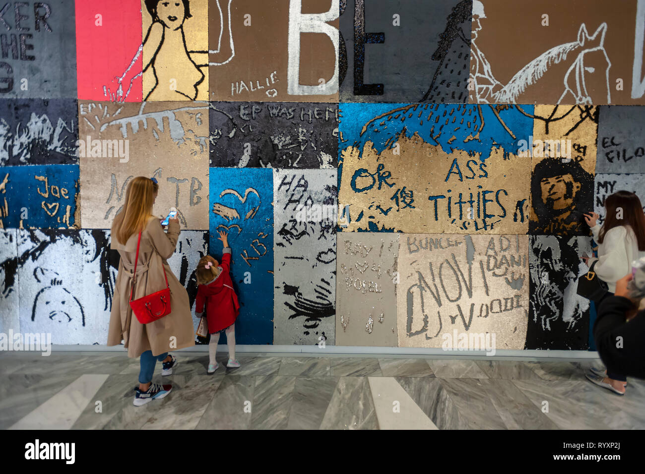 New York, USA. 15th Mar, 2019. Visitors at an interactive art wall in