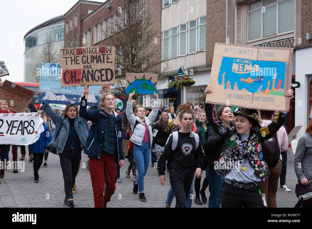 Students from across Devon, UK, come together on a Fridays 4 Future protest march to highlight climate change with Youth Strike 4 Climate Stock Photo