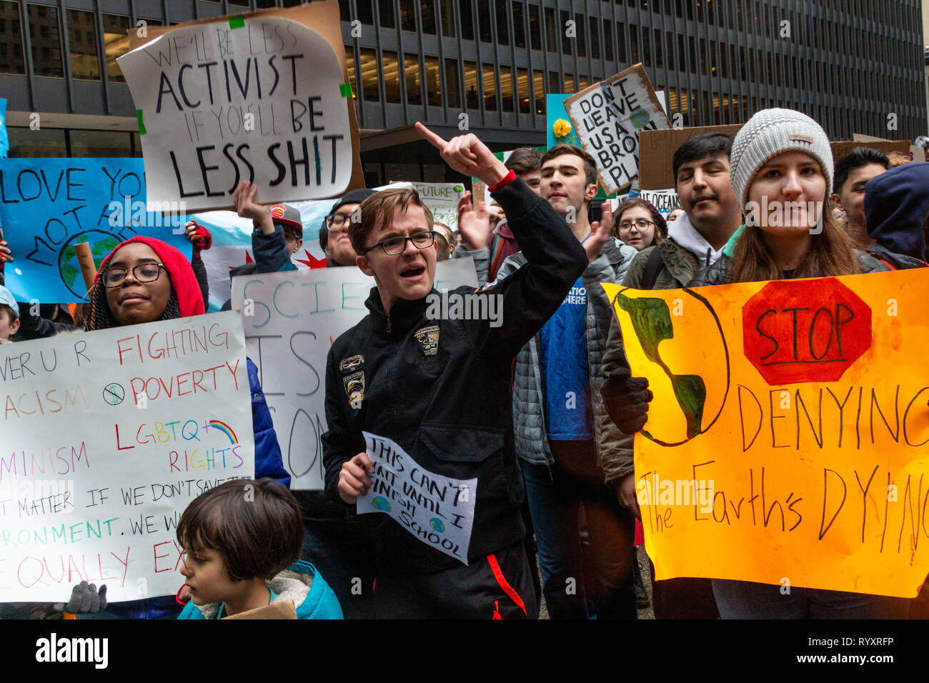 Chicago, USA. 15th Mar, 2019. As part of the world wide 'Youth Climate Strike' a spirited group of Chicago area young folks left their schools this morning, gathered near the Field Museum and marched through Grant Park to Federal Plaza in the loop, chanting their commitment to ending the threat of climate change. In the plaza, young speakers, mostly students from area high schools, exhorted the crowd to hold the government accountable by 'registering to vote, showing up at the polls, and voting them out'  if elected officials deny that climate change is a threat. Credit: Matthew Kaplan/Alamy L Stock Photo