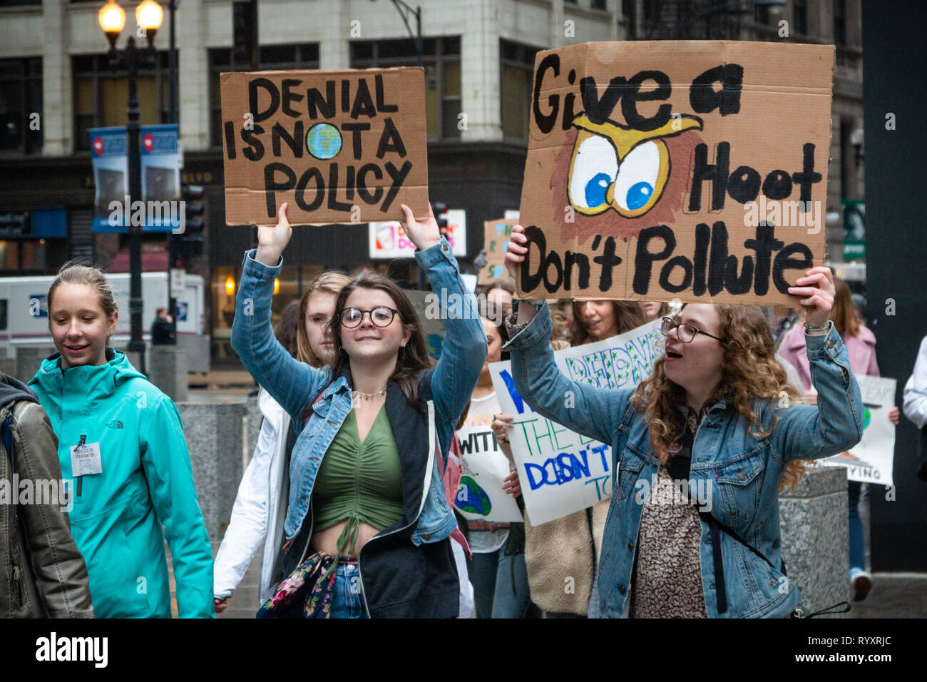 Chicago, USA. 15th Mar, 2019. As part of the world wide 'Youth Climate Strike' a spirited group of Chicago area young folks left their schools this morning, gathered near the Field Museum and marched through Grant Park to Federal Plaza in the loop, chanting their commitment to ending the threat of climate change. In the plaza, young speakers, mostly students from area high schools, exhorted the crowd to hold the government accountable by 'registering to vote, showing up at the polls, and voting them out'  if elected officials deny that climate change is a threat. Credit: Matthew Kaplan/Alamy L Stock Photo