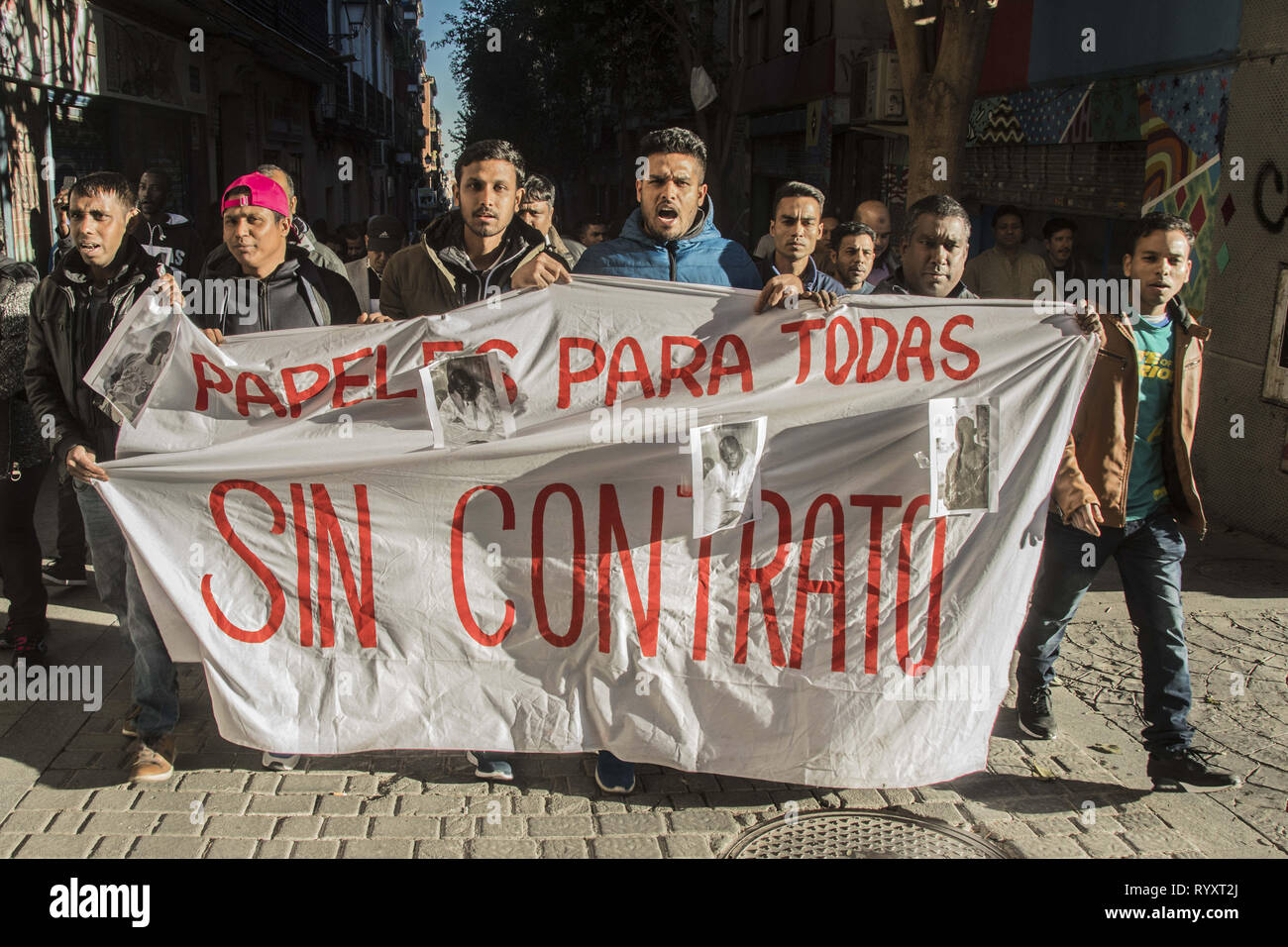 Madrid, Madrid, Spain. 15th Mar, 2019. Demonstrators seen with a banner during the protest.March to commemorate one year of the death of Senegalese vendor Mmame Mbage in Lavapies Square Nelson Mandela. One year ago there was a clash between police and immigrants after Mmame Mbage, died of a cardiac arrest allegedly after being chased by local police. Credit: Alberto Sibaja/SOPA Images/ZUMA Wire/Alamy Live News Stock Photo