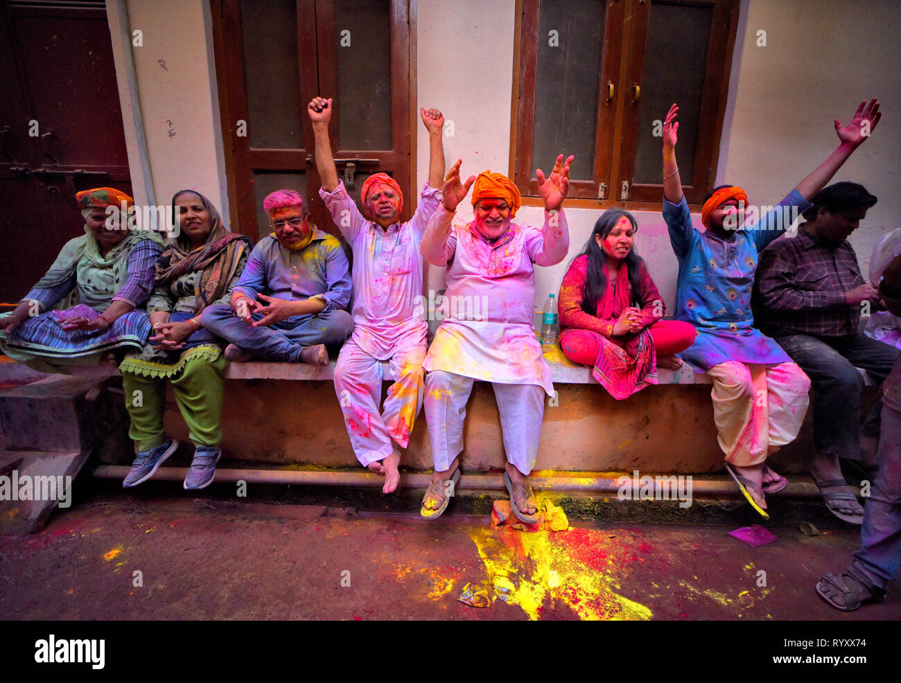 Devotees seen in different mood of celebration during the Lathmar Holi Festival of Barsana. The myth behind this Lathmar Holi is related with Hindu God Lord Krishna who as per local belief came from his hometown Nandgaon to his lovers place at Barsana and teased Radha and her friends. With this common belief since more than 100 years, women of Barsana still maintaining the ritual and beating the outcomers of Nandgaon with sticks (Lathi) to maintain the tradition on this particular day. Stock Photo