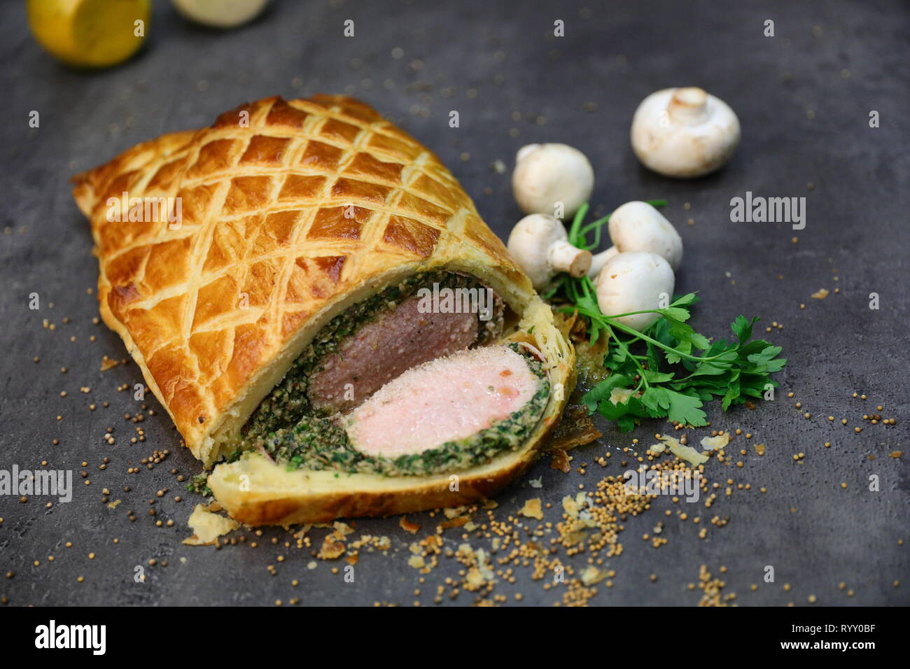 Fillet steak coated with pâté (often pâté de foie gras) and duxelles, which  is then wrapped in puff pastry and baked Stock Photo - Alamy