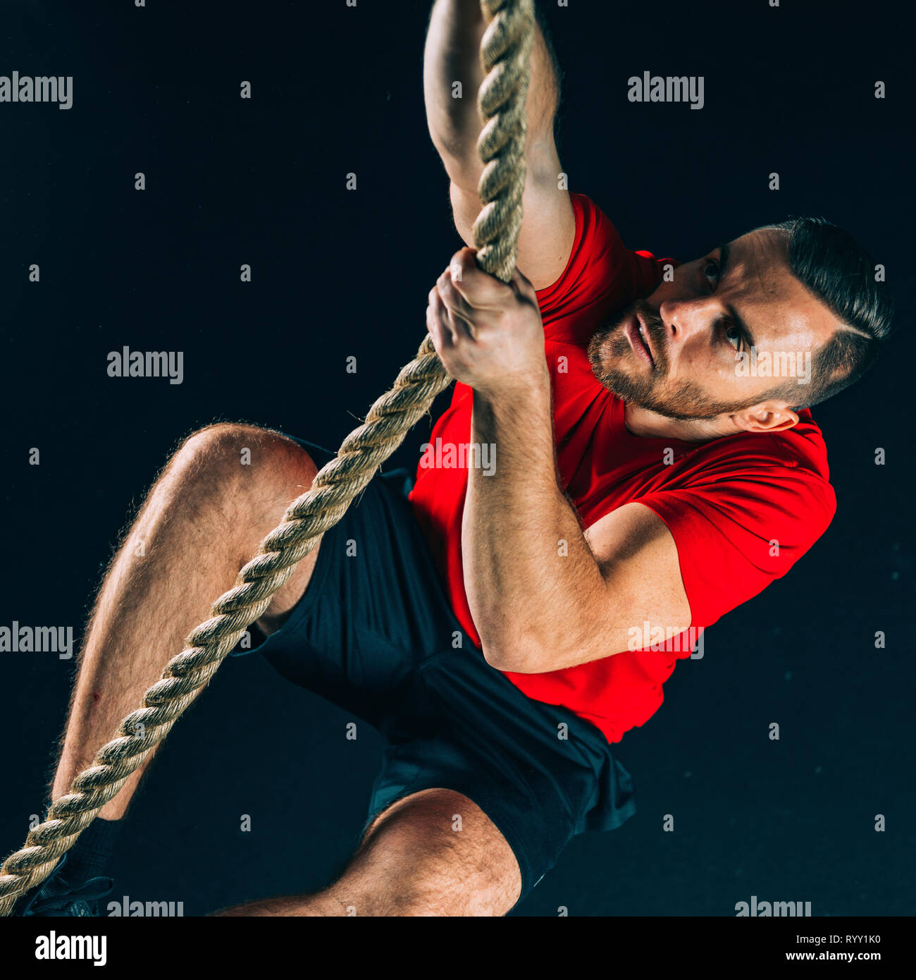 Rope climbing exercise Stock Photo Alamy
