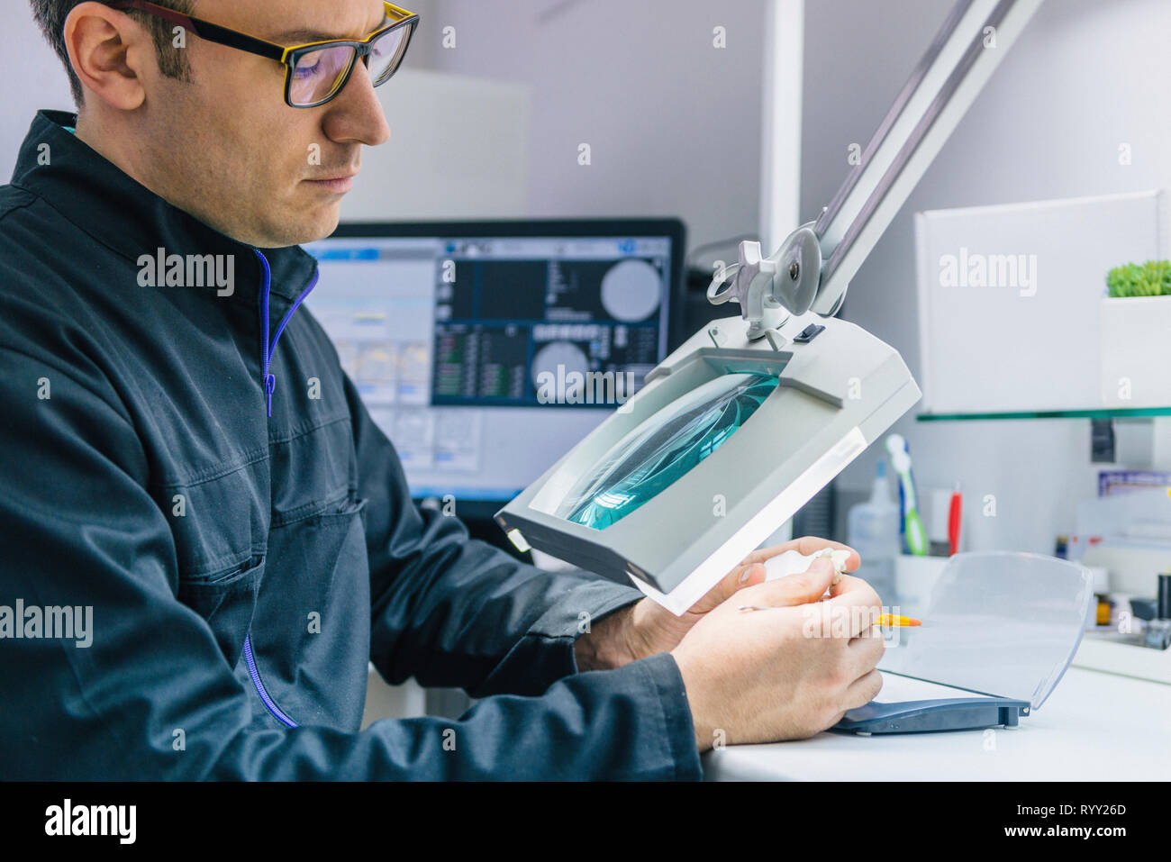 Prosthetic dentistry technician at work Stock Photo Alamy
