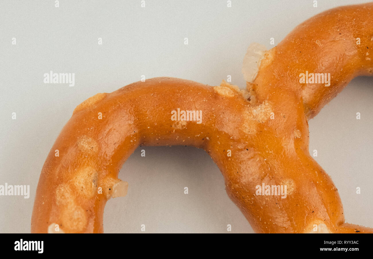 Macro image of a pretzel on white background Stock Photo