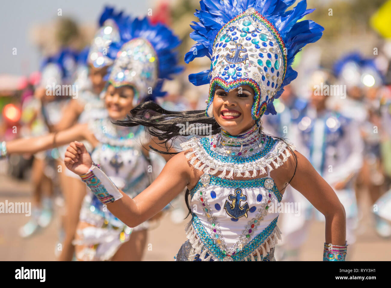 Troupes of young women dancing. The battle of flowers is an event that takes place on Saturday of Carnival. It is a parade of floats, comparsas, cumbi Stock Photo
