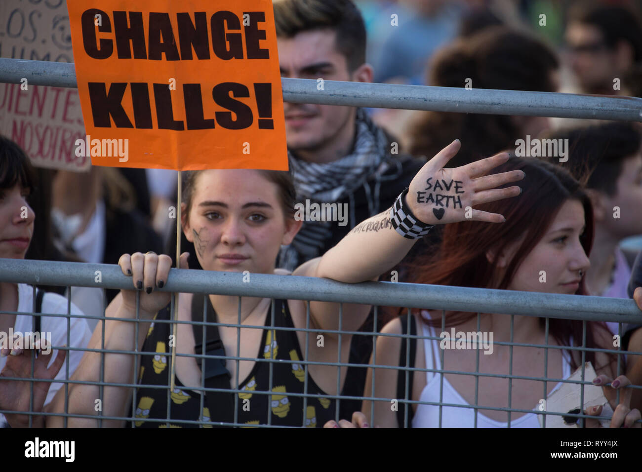 A protester seen with words written on her hand saying Save earth during the demonstration. Hundreds of Spanish students in Madrid join the global movement 'Friday for Future' to demand measures against climate change and protection of the environment. Stock Photo