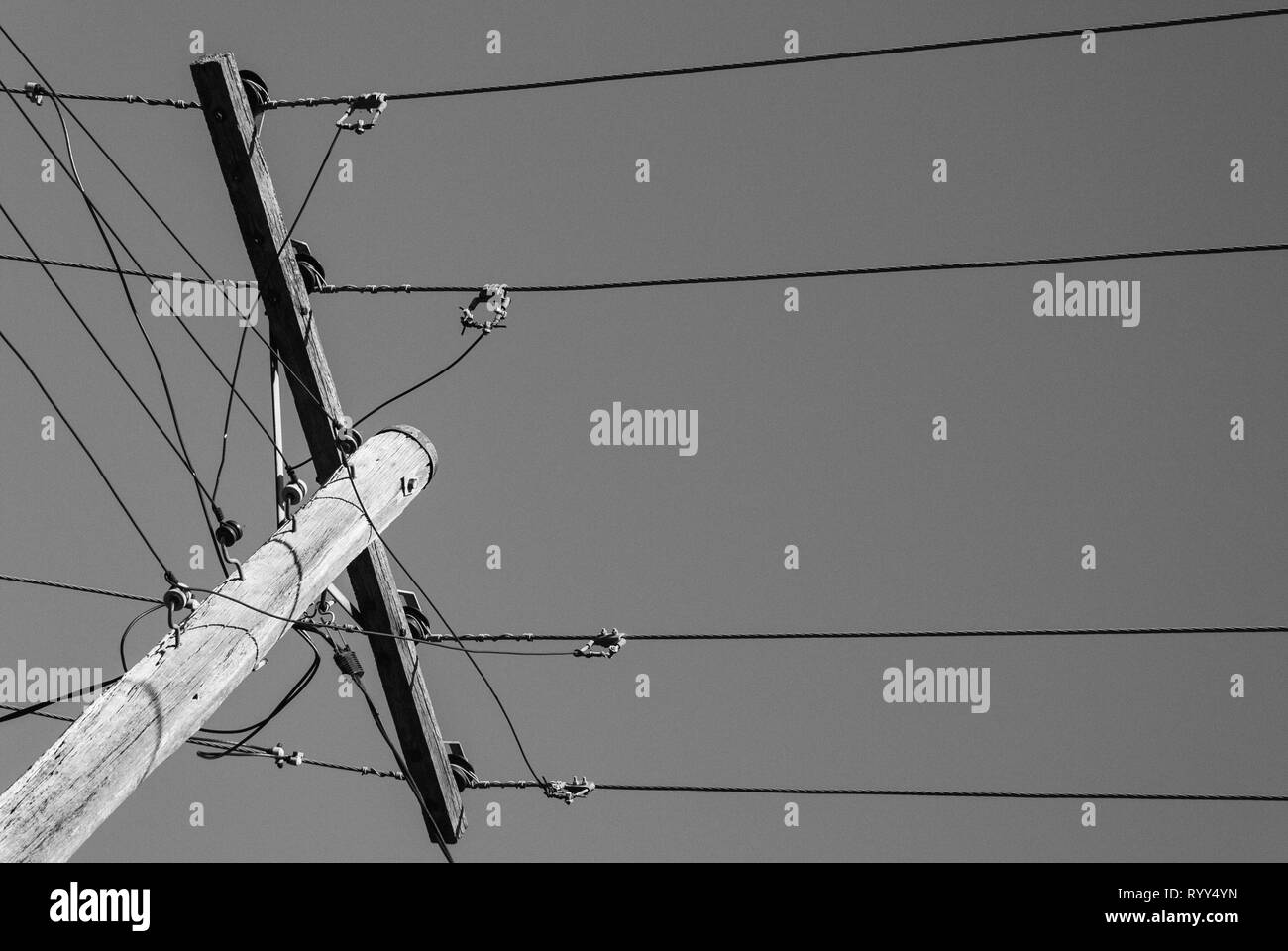 Timber power pole against clear sky Stock Photo