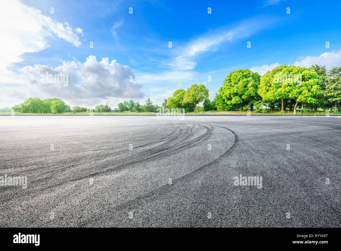 Asphalt race track ground and green woods in the countryside nature ...