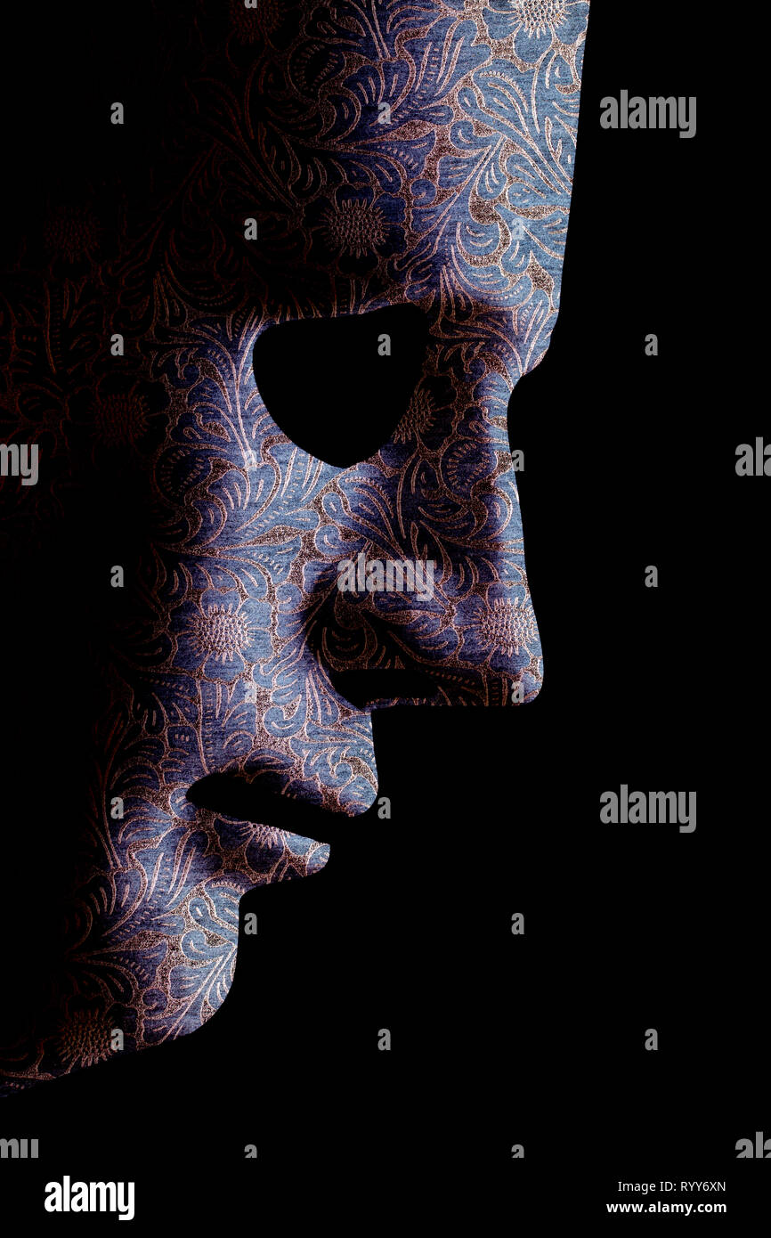 Robot face mask side view close up with textured skin and blank eyes. Black background and space for text. Artificial intelligence concept in a human  Stock Photo