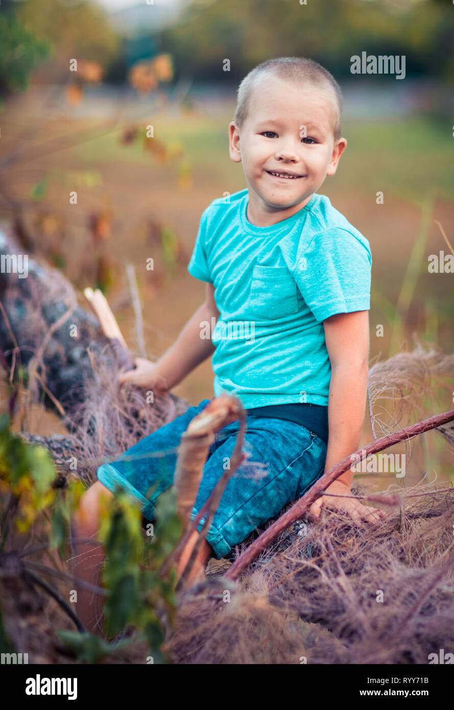 Outdoor portrait of cute little smiling boy Stock Photo - Alamy