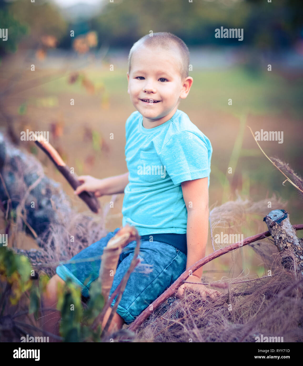 Outdoor portrait of cute little smiling boy Stock Photo - Alamy