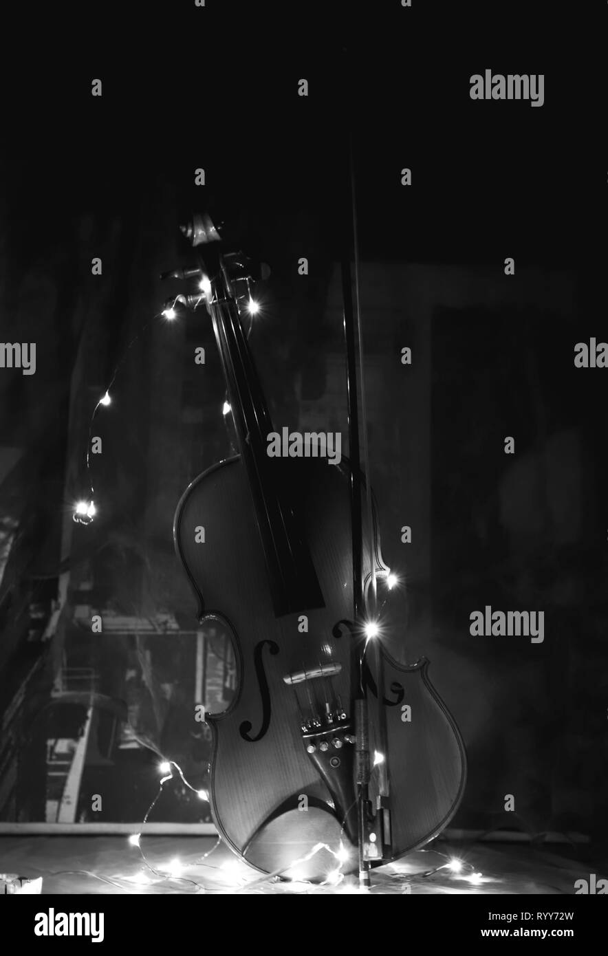 Violin in black and white background with led lights Stock Photo