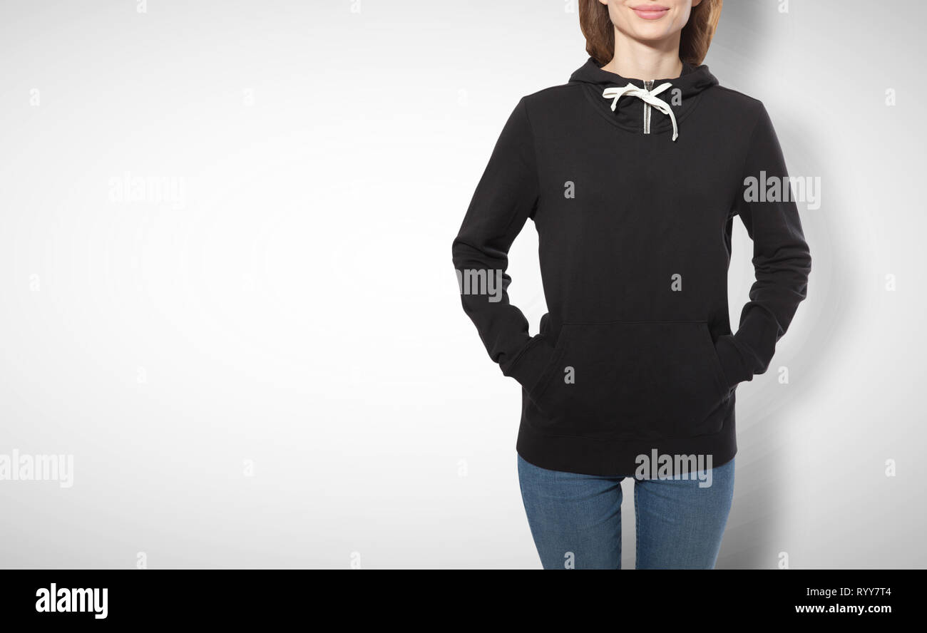 young girl in black sweatshirt, black hoodies front view isolated on white background. mock up Stock Photo
