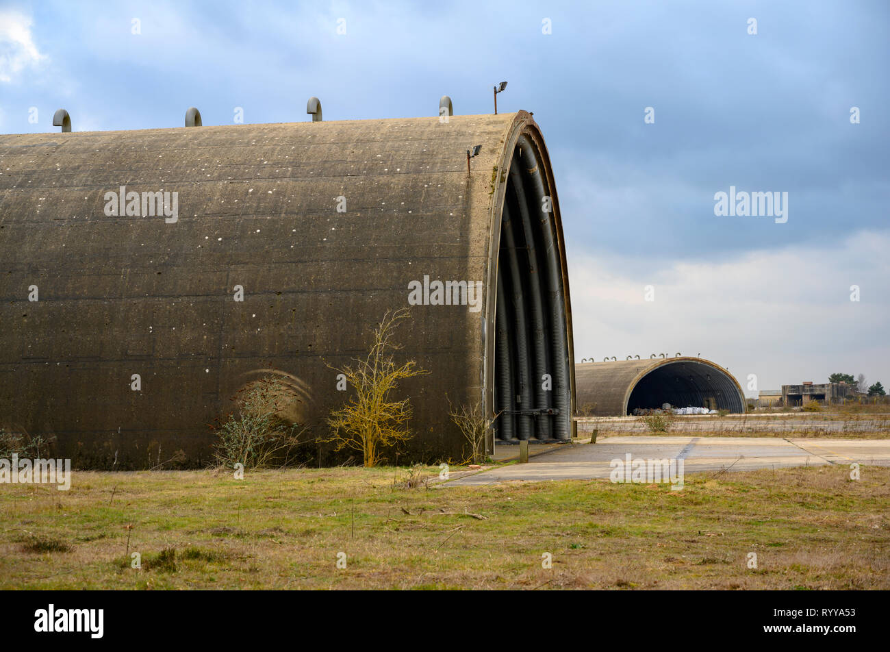 Hardened Cold War era aircraft shelters, RAF Woodbridge, Suffolk, UK. Stock Photo