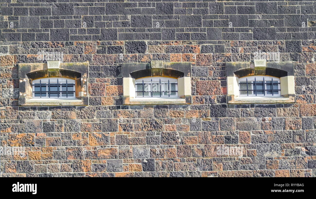 One of the many small grills windows on the jail building in Belfast Stock Photo Alamy