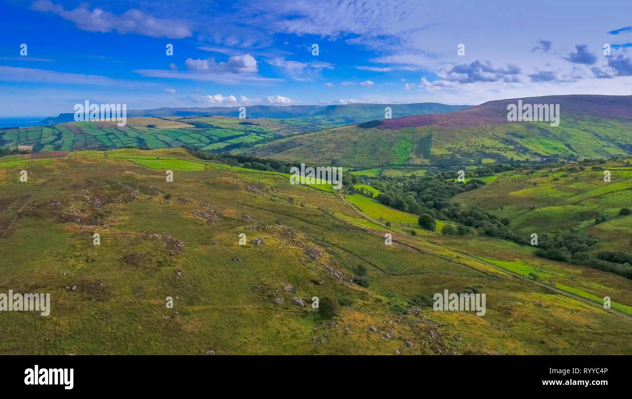 A landscape view of the mountain in Cushendun the green fields from the mountain and the green plants in Ireland Stock Photo
