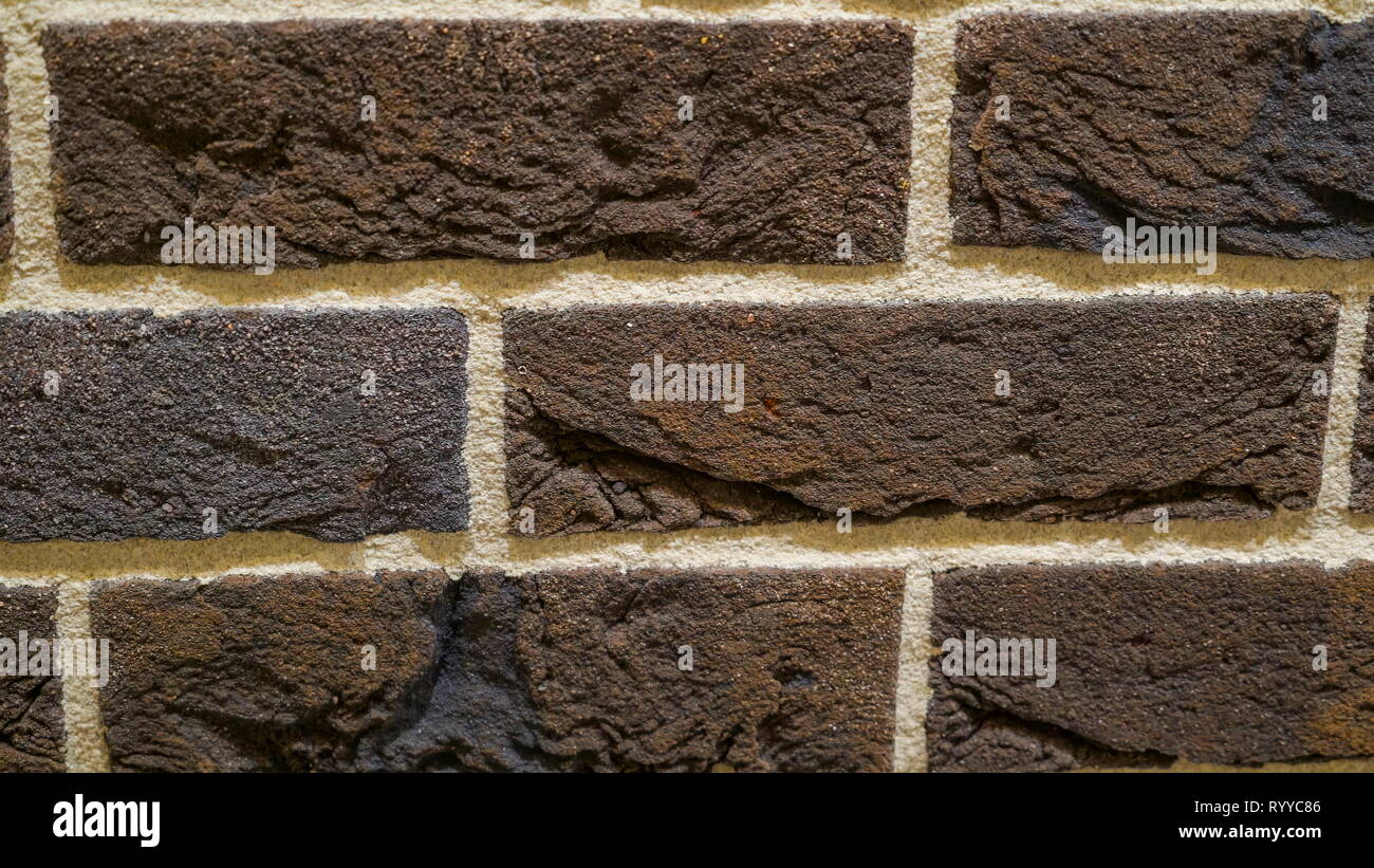 Dark brown tile bricks with the white outline as one of the modern