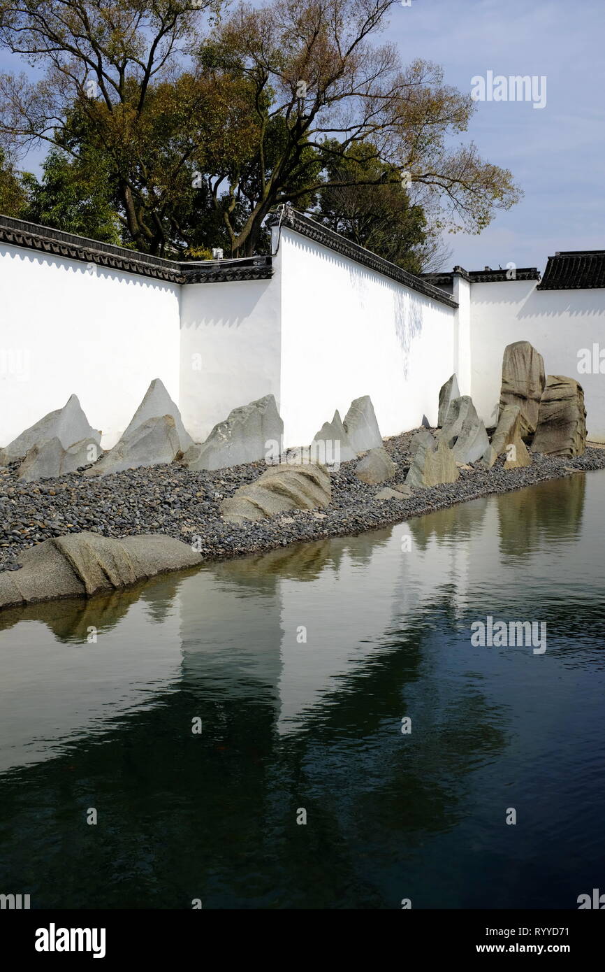 Rockery by the reflecting pool in the garden of Suzhou Museum designed by I.M.Pei. Suzhou.Jiangsu Province.China Stock Photo